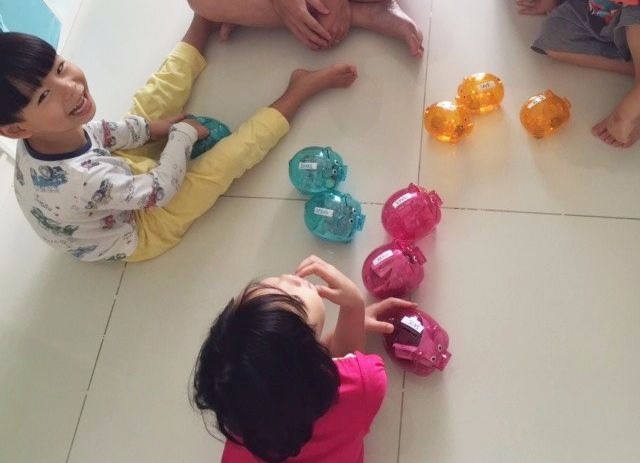 learning money sense with three piggy banks - spend, save, share