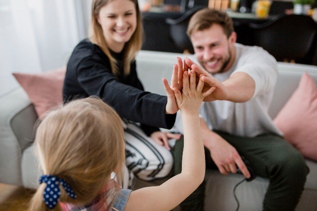hi five with parents
